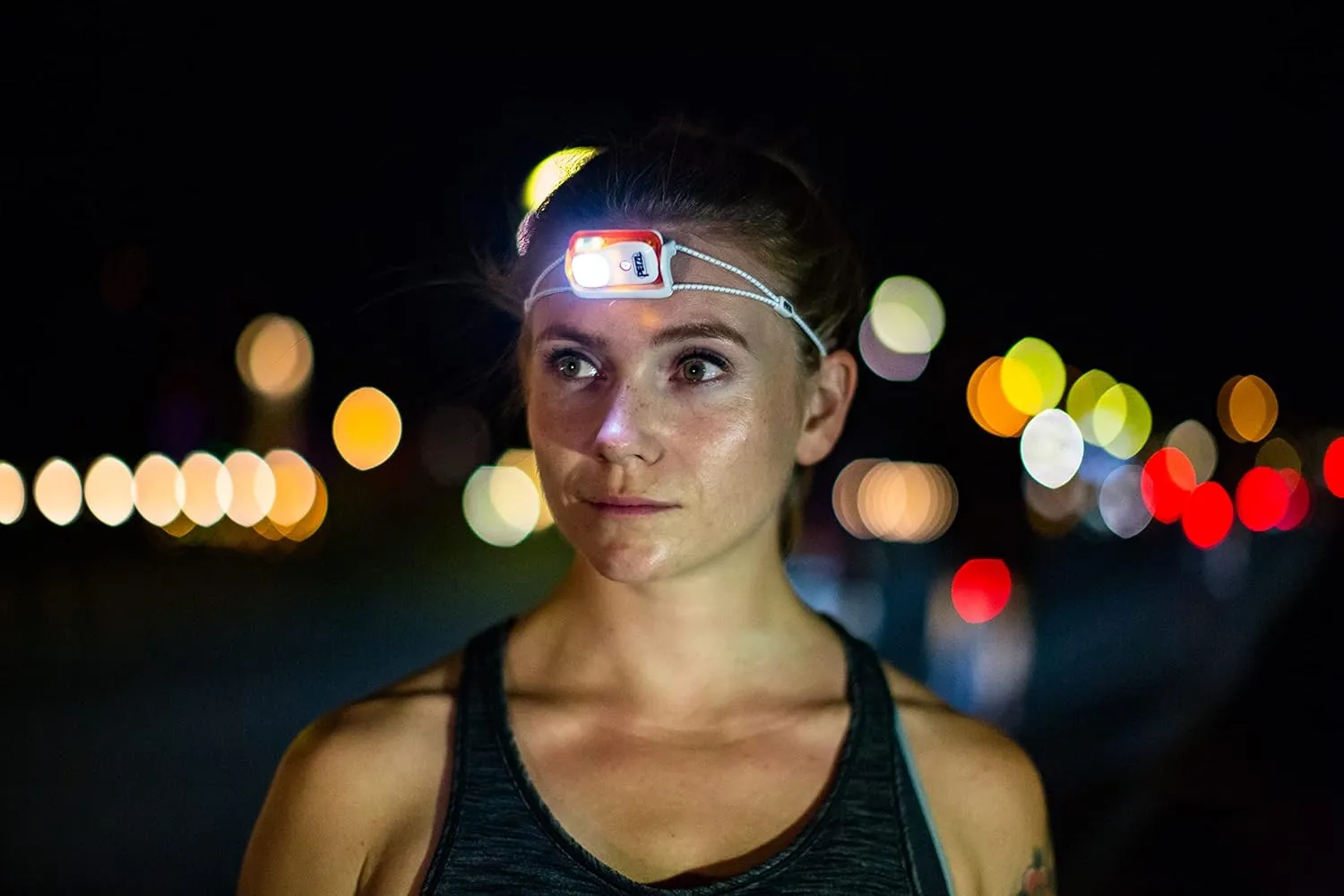 PETZL Bindi Headlamp - Ultra-Compact Rechargeable 200 Lumen Headlamp Designed for Everyday Athletic Activities - Orange